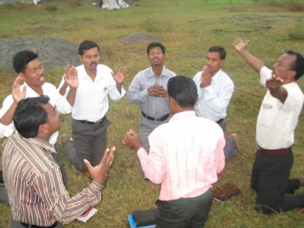 Believers praying outdoors